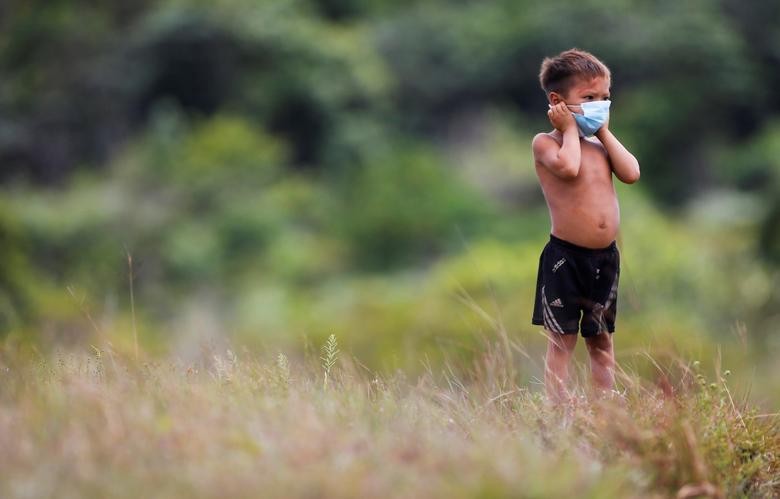 An Indigenous child from Yanomami ethnic group is seen, amid the spread of the coronavirus in the municipality of Alto Alegre, state of Roraima, Brazil. REUTERS/Adriano Machado
